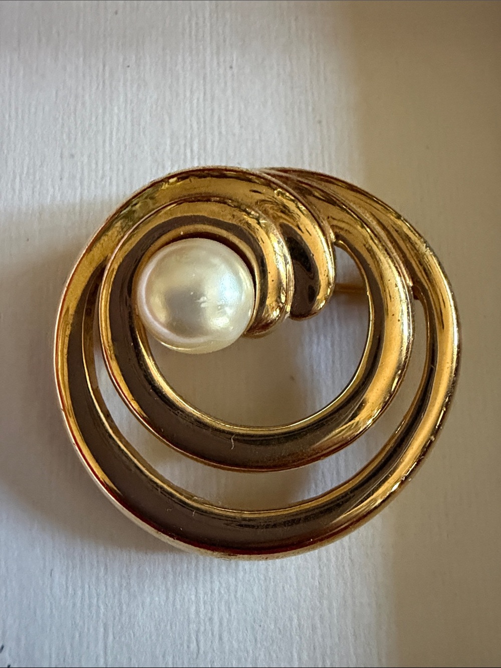 Napier Gold Tone Swirl Brooch with Faux Pearl